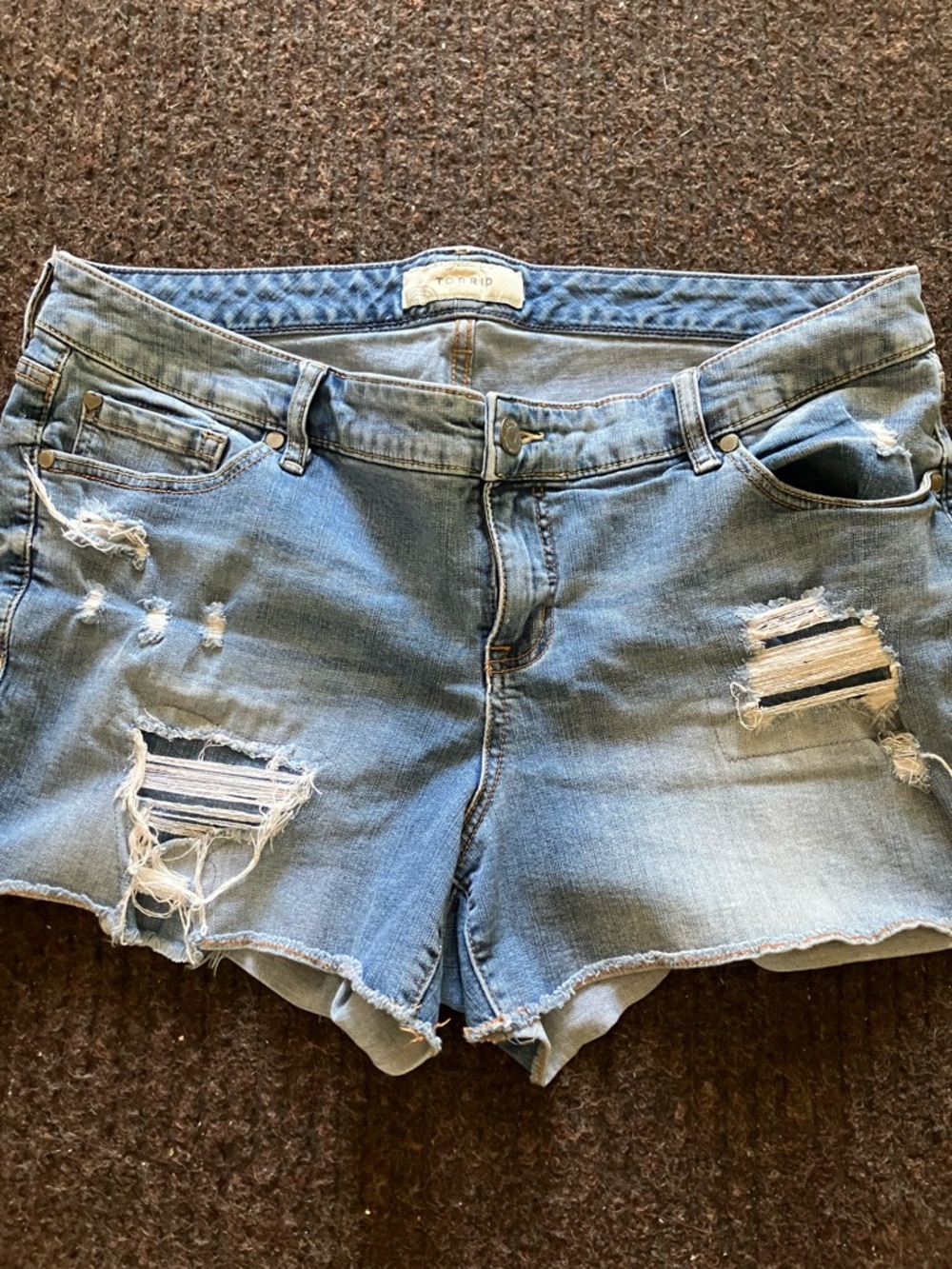 Vintage distressed light blue denim shorts